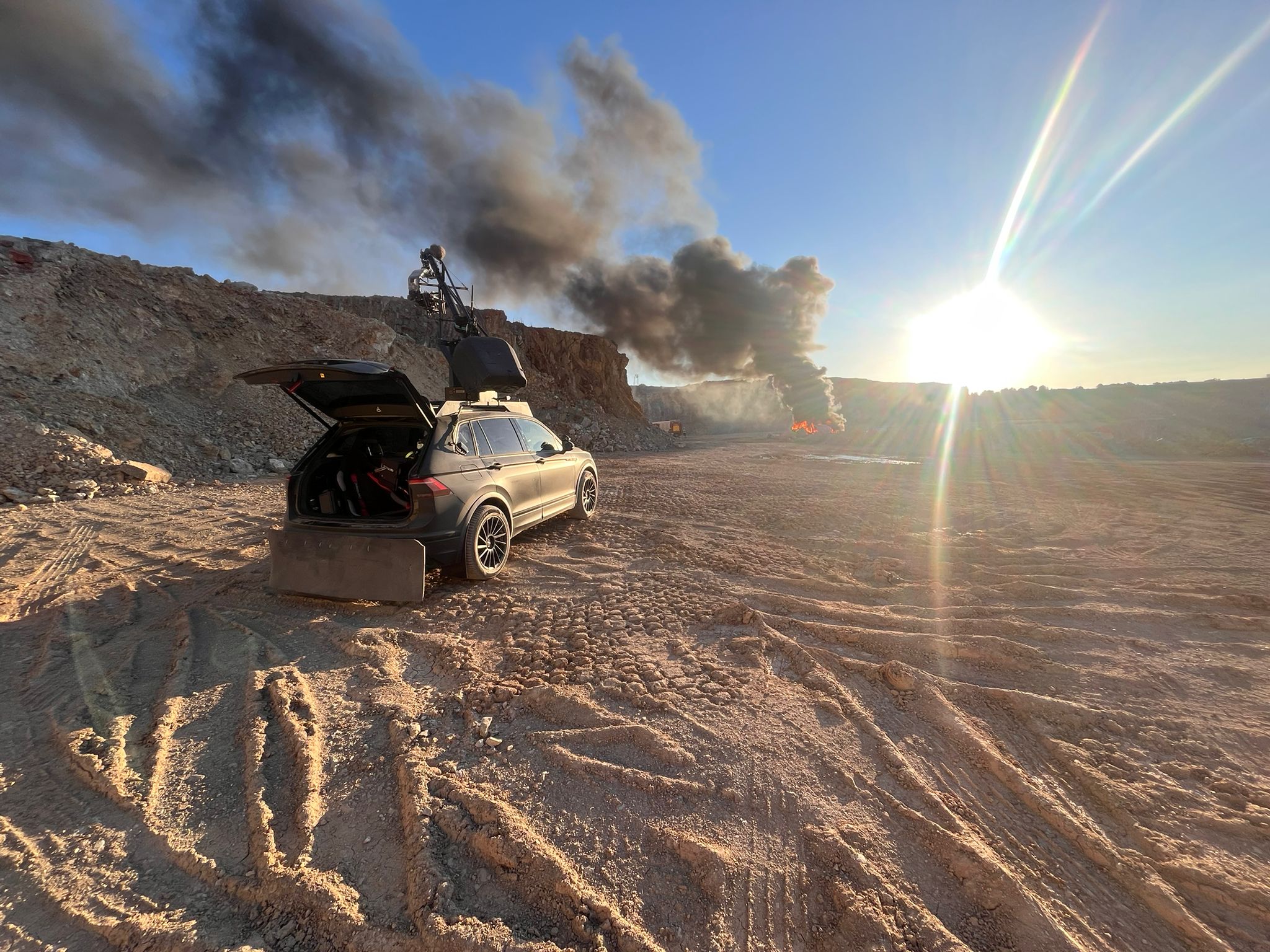 Film crew and drone pilot working together on set